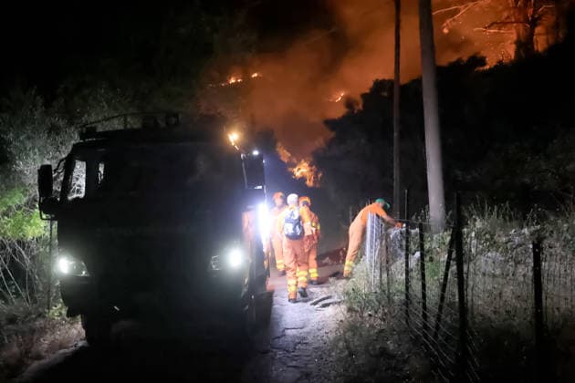 Wildfire threatens communities near Palermo in Sicily as firefighting efforts continue PALERMO, ITALY - JULY 23: Firefighters and civil protection teams battle a wildfire in the Casaboli Forest near Palermo as strong winds push the blaze toward the towns of Monreale, Pioppo and Sagana, while residents are evacuated from threatened homes, in Palermo, Sicily, Italy on July 23, 2026. The wildfire, which started the previous day, spread overnight, prompting emergency crews to work continuously to contain the flames and protect nearby communities. Alberto Lo Bianco Anadolu Palermo Italy. Editorial use only. Please get in touch for any other usage.  Copyright: x2026xAnadoluxAlbertoxLoxBiancox