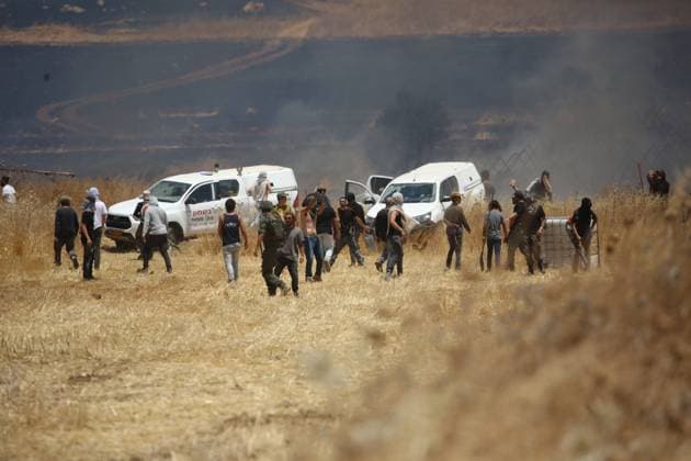 July 23, 2026, Beit Furik, Palestine, State of: BEIT FURIK, WEST BANK Ã¢â‚¬ JULY 23, 2026: Israeli settlers reportedly attack Palestinian farmers as they attempt to extinguish fires in wheat fields in the town of Beit Furik, east of Nablus, in the occupied West Bank. According to Palestinian residents, the fires were allegedly set by Israeli settlers before the confrontation. Beit Furik Palestine, State of - ZUMAq101 20260723_zna_q101_077 Copyright: xNedalxShtiehx