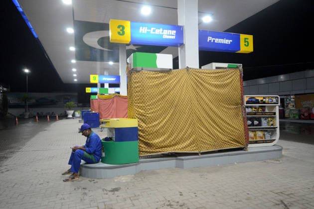 July 22, 2026, Peshawar, Peshawar, Pakistan: Petrol pump attendants stand beside covered fuel dispensers after fuel price hike in PeshawarPESHAWAR, PAKISTAN, 22 JULY: Petrol pump attendants stand beside fuel dispensers covered with fabric at a petrol station in Peshawar, Pakistan, on July 22, 2026, after the government announced another increase in fuel prices. Petrol rose by Rs 6.39 per litre to Rs 327.12, while diesel increased by Rs 7.83 per litre to Rs 375.04. The covered pumps reflect disruptions linked to a nationwide strike by petrol pump owners protesting the daily fuel pricing mechanism. Peshawar Pakistan - ZUMAa217 20260722_znp_a217_037 Copyright: xHussainxAlix