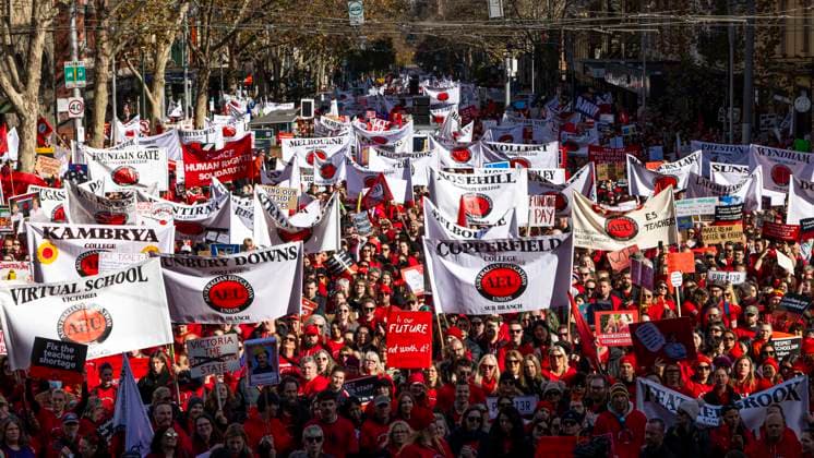 July 23, 2026, Melbourne, Victoria, Australia: Striking teachers carry banners identifying their schools during an Australian Education Union rally on Bourke Street as educators take industrial action over pay and working conditions, in Melbourne, Australia. Melbourne Australia - ZUMAs387 20260723_zip_s387_003 Copyright: xJoshxStanyerx