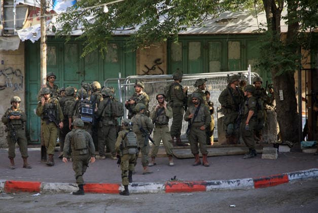 Israeli security forces deploy in Hebron city center Members of the Israeli security forces deploy in the Bab al-Zawiya area in the center of the West Bank city of Hebron on July 23, 2026, while closing streets and restricting the movement of Palestinians to secure the entry of Israeli settlers into the area, according to witnesses. Residents said the measures disrupted daily movement and forced a number of shops to close during the settlers visit. Photo by Mamoun Wazwaz apaimages Hebron West Bank Palestinian Territory 230726_Hebron_MW_00(23) Copyright: xapaimagesxMamounxWazwazx xapaimagesx