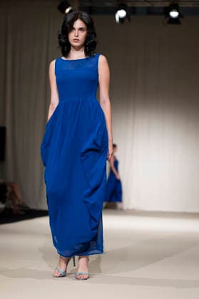 UNIENDO MODA - MOMAD Fashion Week de Madrid ,Spain - 23 Jul 2026 A model walks the runway wearing a design by UNIENDO MODA during the Momad Fashion Week de Madrid in IFEMA. Madrid Spain Copyright: xAtilanoxGarciax xSOPAxImagesx photo03005
