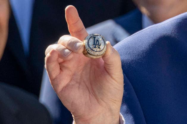US President Donald J. Trump hosts an event to honor the 2025 World Series Champion Los Angeles Dodgers US President Donald J. Trump receives a World Series Championship ring from Dodgers owner Mark Walter during an event to honor the 2025 World Series Champion Los Angeles Dodgers in the Rose Garden at the White House in Washington, DC, USA, 23 July 2026. WASHINGTON DISTRICT OF COLUMBIA United States  Copyright: xPool ABACAx