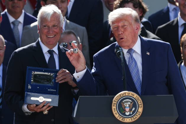 Mark Walter gives a ring to President Donald Trump during an event with the 2025 MLB World Series Champions the Los Angeles Dodgers in the Rose Garden at the White House on Thursday, July 23, 2026 in Washington, DC. The Dodgers have won the last two MLB World Series.  WASP2026072303 SamxCorum
