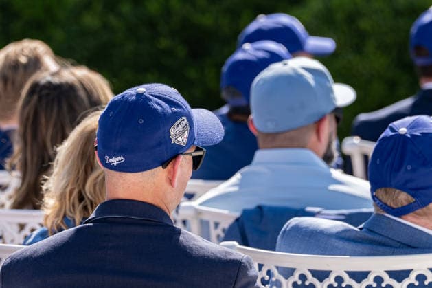 July 23, 2026, Washington, District Of Columbia, Unites States: Attendees wear 2025 World Series championship hats during a ceremony honoring the 2025 World Series champion Los Angeles Dodgers at the White House. Washington Unites States - ZUMAk206 20260723_znp_k206_023 Copyright: xMattxKaminskyx