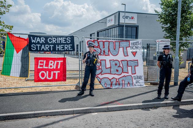 Elbit Systems Filton Bristol Pro-Palestine Protest - 23 Jul 2026 Police Officers guard the Elbit Systems factory during the rally. Pro-Palestinian protestors gathered outside Elbit Systems factory in Filton, Bristol to accuse the arms company of supplying Israel with weaponry and drones for its war in Gaza. Bristol United Kingdom Copyright: xLabxMox xSOPAxImagesx LabMO_Elbit_Systems_Filton_Protest_Sopa_2.jpeg