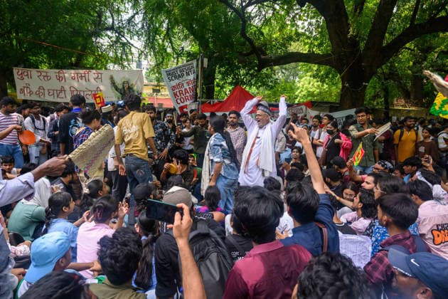 July 22, 2026, New Delhi, New Delhi, India: NEW DELHI, India Ã¢â‚¬? An older demonstrator raises his fists and shouts amid a crowd beneath banners demanding Union Minister Dharmendra Pradhan s resignation, at Jantar Mantar, July 22, 2026. New Delhi India  - ZUMAm184 20260722_zip_m184_064 Copyright: xAnkitxRoyxMajumderx
