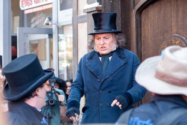 SAN DIEGO, CA - JULY 23: Johnny Depp interacts with fans at a surprise appearance as Ebenezer Scrooge promoting his new film, Ebenezer: A Christmas Carol, outside 2026 San Diego Comic Con on July 23, 2026. Copyright: xTonyxFortex