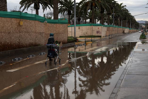July 23, 2026, La Serena, Chile: A person walks along a flooded street following a storm that affected various regions of the country, causing widespread flooding and power outages. A state of catastrophe was declared for La Serena, Chile. La Serena Chile - ZUMAu105 20260723_zip_u105_009 Copyright: xManuelxUrzuax