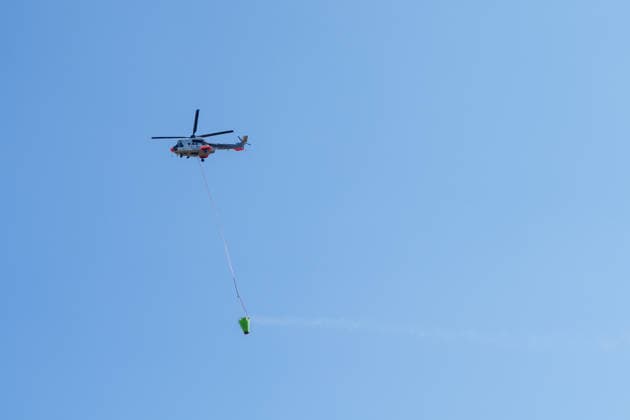 Wildfire reignites with strong Mistral wind in France. France - Cotignac, 23.07.2026 A Helicopter as a wildfire spreads again near Cotignac in the Var department, southeastern France on Thursday. Strong Mistral winds fueled renewed fire activity, prompting a large firefighting operation. Departement Var