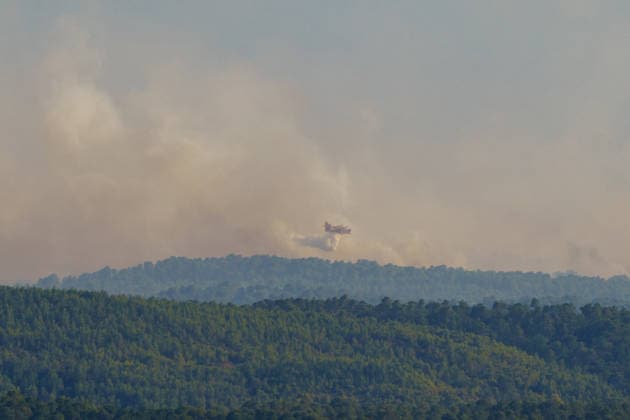 Wildfire reignites with strong Mistral wind in France. France - Cotignac, 23.07.2026 Canadair CL-415 water release toward the fire sites as a wildfire spreads again near Cotignac in the Var department, southeastern France on Thursday. Strong Mistral winds fueled renewed fire activity, prompting a large firefighting operation. Departement Var