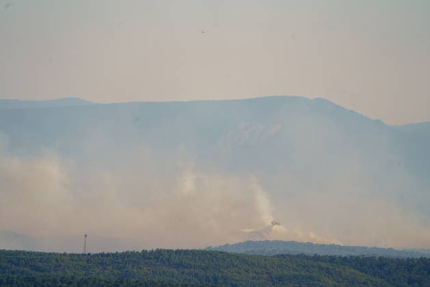Wildfire reignites with strong Mistral wind in France. France - Cotignac, 23.07.2026 Canadair CL-415 water release toward the fire sites as a wildfire spreads again near Cotignac in the Var department, southeastern France on Thursday. Strong Mistral winds fueled renewed fire activity, prompting a large firefighting operation. Departement Var