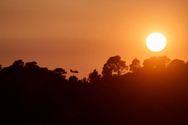Wildfire reignites with strong Mistral wind in France. France - Cotignac, 23.07.2026 Silhouette of a Canadair CL-415 in the sunset as a wildfire spreads again near Cotignac in the Var department, southeastern France on Thursday. Strong Mistral winds fueled renewed fire activity, prompting a large firefighting operation. Departement Var