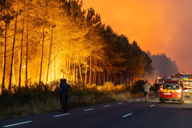 Flames Engulf Pine Forest During Gironde Wildfires - Le Porge Firefighters battle a major wildfire burning through a pine forest in the Gironde department. Fire engines and emergency crews are deployed along the roadside as flames spread through the vegetation during a large-scale firefighting operation near Le Porge, France, on July 23, 2026. Photo by Margot Le Gonidec ABACAPRESS.COM Le Porge France  Copyright: xLexGonidecxMargot ABACAx