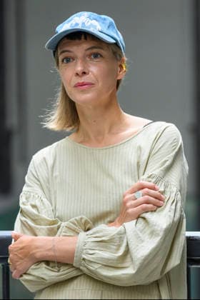July 24, 2026, London, London, UK: Artist Lina LapelytÄ poses with her created maze-like installation, transforming the Turbine Hall into a collaborative stage. Audiences are invited to co-create in a piece of mass choreography, moving through a grid of wooden barriers. You are also free to quietly watch the performance unfold, from the Turbine Hall bridge. London, UK. London UK  - ZUMAl94_ 20260724_zaf_l94_006 Copyright: xRayxTangx
