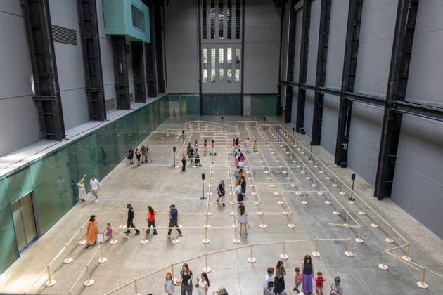 July 24, 2026, London, London, UK: Visitors interact with artist Lina LapelytÄ Ã¢â‚¬â ¢created maze-like installation, transforming the Turbine Hall into a collaborative stage. Audiences are invited to co-create in a piece of mass choreography, moving through a grid of wooden barriers. You are also free to quietly watch the performance unfold, from the Turbine Hall bridge. London, UK. London UK  - ZUMAl94_ 20260724_zaf_l94_012 Copyright: xRayxTangx