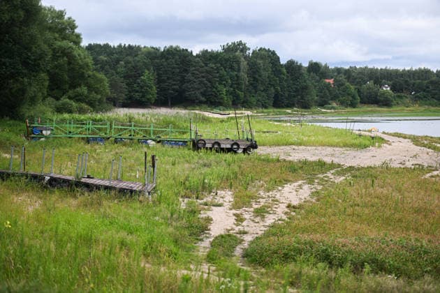 Poland s drought intensifies as climate change dries reservoirs RAKOW, POLAND - JULY 24: Piers stand on exposed ground along the shoreline of the Chancza Reservoir as water levels drop due to the ongoing drought in Rakow, Poland, on July 24, 2026. Low water levels have been recorded at 66 percent of Poland s hydrological monitoring stations. Earlier in July, Poland s national weather agency warned that hydrological drought had spread across much of the country. Officials reported falling river levels, declining groundwater supplies, and an increasing number of monitoring stations recording flows below long-term minimum thresholds. Omar Marques Anadolu Rakow Poland. Editorial use only. Please get in touch for any other usage.  Copyright: x2026xAnadoluxOmarxMarquesx