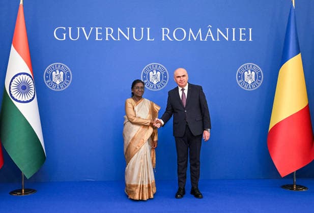 RECORD DATE NOT STATED President Droupadi Murmu meets Prime Minister of Romania Ilie Bolojan Bucharest Romania , Jul 24 (ANI): President Droupadi Murmu meets Prime Minister of Romania Ilie Bolojan, at Victoria Palace, in Bucharest on Friday. (@rashtrapatibhvn X ANI Photo) Bucharest Romania Copyright: xANIx ANI_20260724224