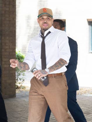 July 24, 2026, London, England, United Kingdom: R&B singer CHRIS BROWN leaves Southwark Crown Court after a case management hearing. He is charged over an alleged assault in a London nightclub. The American musician is accused of causing grievous bodily harm to Abraham Diaw in February 2023. London United Kingdom - ZUMAs262 20260724_zip_s262_008 Copyright: xTayfunxSalcix