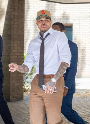 July 24, 2026, London, England, United Kingdom: R&B singer CHRIS BROWN leaves Southwark Crown Court after a case management hearing. He is charged over an alleged assault in a London nightclub. The American musician is accused of causing grievous bodily harm to Abraham Diaw in February 2023. London United Kingdom  - ZUMAs262 20260724_zip_s262_003 Copyright: xTayfunxSalcix
