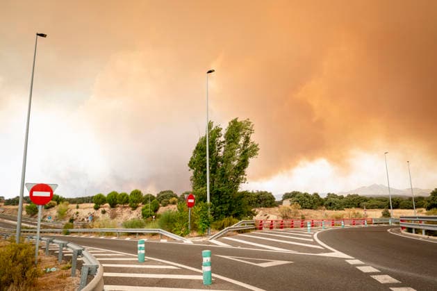 The wildfires in the Community of Madrid have merged into a single front, and a third front is being monitored from Ávila. Road blocked, July 2, 2026, in Chapinería, Madrid, Spain. The wildfires affecting the Community of Madrid continue to spread unchecked and have merged into a single fire, while in Ávila, the Burgohondo fire is also advancing unchecked, forcing the central government to declare a national emergency on a day when weather forecasts of strong gusts of wind are hampering firefighting efforts. So far, 9,000 hectares have been burned in Ávila and another 6,000 in Madrid JULY 24, 2026 FOREST FIRE A Pé Madrid Madrid Spain  Copyright: xA.xPÃ rezxMecax 7685224