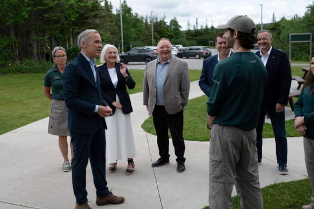 July 24, 2026, Gros Morne National Park, Nl, CANADA: Prime Minister Mark Carney greets Parks Canada staff on the visitor centre grounds during a visit to Gros Morne National Park, N.L., Friday, July 24, 2026. Gros Morne National Park CANADA  - ZUMAc35_ 20260724_zaf_c35_014 Copyright: xJessicaxStapletonx