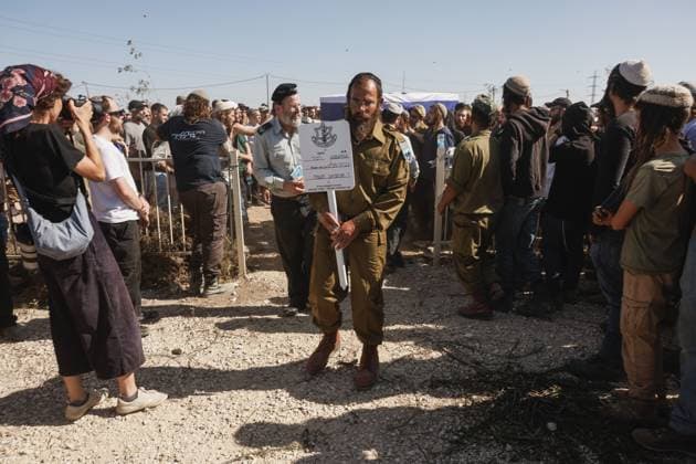 Thousands Attend Funeral of Benayahu Melet, Killed Defending Hikers Near Havat Gilad HAVAT GILAD, WEST BANK JULY 24, 2026: Thousands gathered to pay their final respects and lay to rest Benayahu Melet, a member of the Havat Gilad civilian alert squad and the community s agriculture director. Melet, 32, was killed earlier that day after rushing to assist a group of Israeli hikers who had been attacked near the community. During the incident, a Palestinian assailant seized his weapon and shot him dead. He is survived by his wife, Esther, and their two daughters, Tair Eretz and Adama Ivriya. Following his death, Melet was recognized as a fallen IDF soldier and given a military burial. A second Israeli, IDF Major Yuval Ezra, 27, was also ki Copyright: x xHilelxbenxorx xJNAxPressx