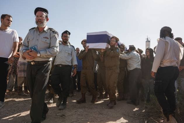 Thousands Attend Funeral of Benayahu Melet, Killed Defending Hikers Near Havat Gilad HAVAT GILAD, WEST BANK JULY 24, 2026: Thousands gathered to pay their final respects and lay to rest Benayahu Melet, a member of the Havat Gilad civilian alert squad and the community s agriculture director. Melet, 32, was killed earlier that day after rushing to assist a group of Israeli hikers who had been attacked near the community. During the incident, a Palestinian assailant seized his weapon and shot him dead. He is survived by his wife, Esther, and their two daughters, Tair Eretz and Adama Ivriya. Following his death, Melet was recognized as a fallen IDF soldier and given a military burial. A second Israeli, IDF Major Yuval Ezra, 27, was also ki Copyright: x xHilelxbenxorx xJNAxPressx
