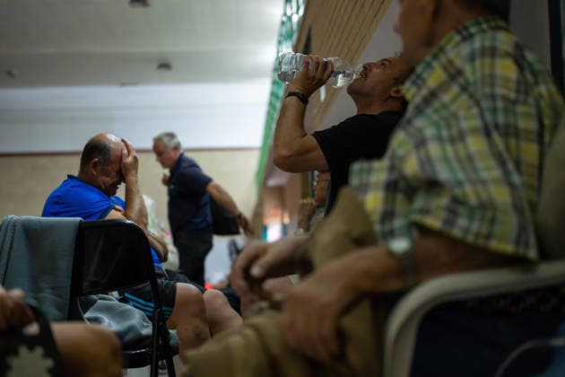 July 24, 2026, Madrid, Madrid, Spain: Nearly 1,000 people evacuated due to a wave of wildfires in the southwest of the Madrid region spend the night sheltered at the Villamanta municipal sports center, hastily converted into an emergency reception facility. Madrid Spain - ZUMAd308 20260724_zsp_d308_015 Copyright: xJuanxCarlosxLucasx