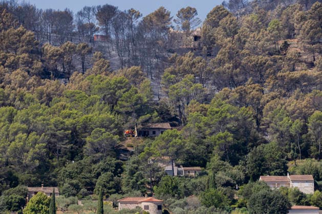 Wildfires in the Var - Cotignac - France A burned hillside overlooks homes after a major wildfire near Cotignac, firefighters remain deployed to protect isolated properties as the fire leaves extensive damage across the Mediterranean forest. Var, France, July 24, 2026. Photo by Thibaut Durand ABACAPRESS.COM. Cotignac Provence-Alpes-Cote d Azur France  Copyright: xDurandxThibaut ABACAx