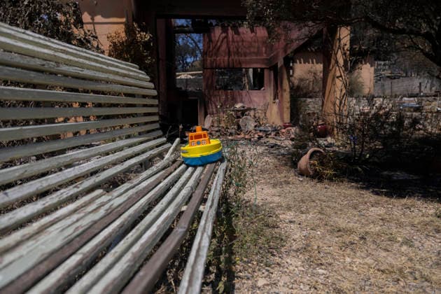 Wildfires in the Var - Cotignac - France A child toy boat rests on a bench outside a house destroyed by a major wildfire near Cotignac, The toy contrasts with the burned home and scorched garden, illustrating the human impact of the disaster on everyday family life. Var, France, July 24, 2026. Photo by Thibaut Durand ABACAPRESS.COM. Cotignac Provence-Alpes-Cote d Azur France  Copyright: xDurandxThibaut ABACAx