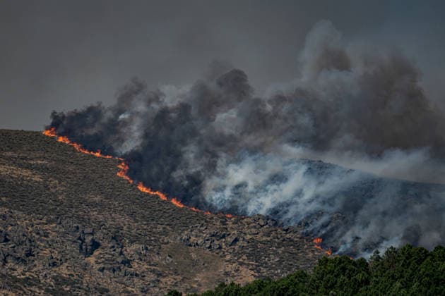 Wildfire in the province of Avila, Spain AVILA, SPAIN - JULY 24: Smoke rises over Avila as a forest fire triggers an extreme alert in central Spain, including Madrid and other nearby regions on July 24, 2026. Diego Radames Anadolu Avila Spain. Editorial use only. Please get in touch for any other usage.  Copyright: x2026xAnadoluxDiegoxRadamesx