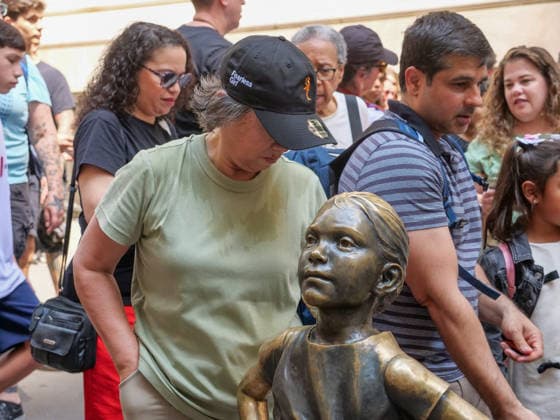 July 24, 2026, New York, New York, USA: Fearless Girl Block Party outside the NYSE. The Ten Year anniversary of the.girl empowering sculpture by Kristen Visbal was celebrated with music, free giveaways, and.live vendors. The event pays homage to the millions who line up to be photographed with her..State Street an exchange traded fund commissioned the art work in 2017 which originally stood opposite the .Wall Street Charging Bull but was moved to opposite the Stock Excahnge encouraging girls theu can do anything. New York USA  - ZUMAh156 20260724_znp_h156_003 Copyright: xMiloxHessx