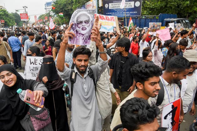 Kolkata Rally Supports CJP Protest A demonstrator raises a large caricature placard above the rally crowd in Kolkata, India, on July 24, 2026. The rally was held in solidarity with the Cockroach Janta Party s ongoing protest at New Delhi s Jantar Mantar demanding the resignation of Education Minister Dharmendra Pradhan over alleged NEET examination irregularities, as leaders of the youth-led movement held a second round of talks with government officials after Prime Minister Narendra Modi pledged legal reforms and swift punishment for those involved in exam paper leaks. Kolkata West Bengal India Copyright: xDebajyotixChakrabortyx