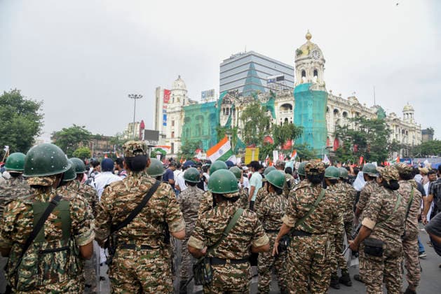 Kolkata Rally Supports CJP Protest A line of helmeted security personnel faces demonstrators carrying Indian flags in Kolkata, India, on July 24, 2026. The rally was held in solidarity with the Cockroach Janta Party s ongoing protest at New Delhi s Jantar Mantar demanding the resignation of Education Minister Dharmendra Pradhan over alleged NEET examination irregularities, as leaders of the youth-led movement held a second round of talks with government officials after Prime Minister Narendra Modi pledged legal reforms and swift punishment for those involved in exam paper leaks. Kolkata West Bengal India Copyright: xDebajyotixChakrabortyx