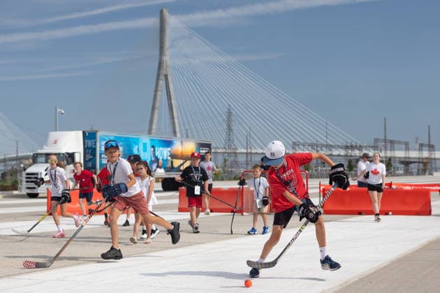 July 24, 2026, Windsor, On, CANADA: Kids play ball hockey at the ribbon cutting ceremony for the opening of the Gordie Howe International Bridge, in Windsor, Ont., Friday, July 24, 2026. Windsor CANADA  - ZUMAc35_ 20260724_zaf_c35_093 Copyright: xDaxxMelmerx