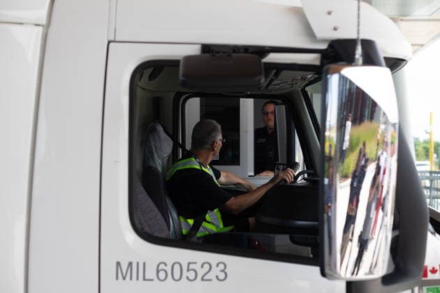 July 24, 2026, Windsor, On, CANADA: A Canada Border Services agent performs a mock questioning of a trucker at the Gordie Howe International Bridge, in Windsor, Ont., Friday, July 24, 2026. Windsor CANADA  - ZUMAc35_ 20260724_zaf_c35_101 Copyright: xDaxxMelmerx