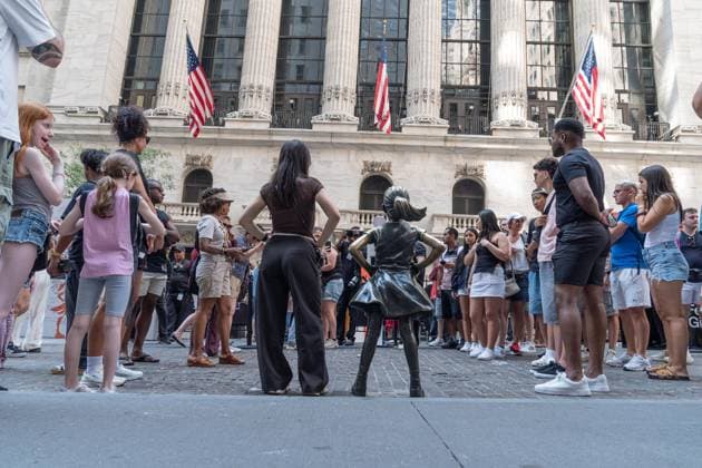 July 24, 2026, New York, New York, USA: State Street (index STT) rings closing bell to celebrate Fearless Girl of the New York Stock Exchange (NYSE) in New York, NY on July 24, 2026. The Fearless Girl is a famous four-foot bronze statue created by artist Kristen Visbal and commissioned by State Street Global Advisors (a division of State Street Corporation). To mark the occasion State Street throw the block party in front of NYSE. New York USA  - ZUMAr339 20260724_znp_r339_003 Copyright: xLevxRadinx