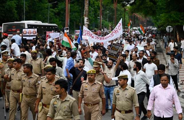 LUCKNOW, INDIA - JULY 24: Students and left organizations shout slogans during a protest march from Parivartan Chowk to Shahid Smarak Lucknow in solidarity with the ongoing protest at New Delhi s Jantar Mantar demanding the resignation of India s Education Minister Dharmendra Pradhan over alleged NEET exam irregularities on July 24, 2026 in Lucknow, India. (Photo by Deepak Gupta Hindustan Times) Protest March In Lucknow In Solidarity With Ongoing Jantar Mantar Protest Against NEET-UG Examination Paper Leak