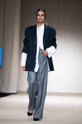 ROMANIAN DESIGNERS - MOMAD Fashion Week de Madrid ,Spain - 24 Jul 2026 A model walks the runway wearing a design by Romanian designers during Momad Fashion Week de Madrid in IFEMA Madrid Spain Copyright: xAtilanoxGarciax xSOPAxImagesx photo03110