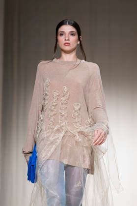 ROMANIAN DESIGNERS - MOMAD Fashion Week de Madrid ,Spain - 24 Jul 2026 A model walks the runway wearing a design by Romanian designers during Momad Fashion Week de Madrid in IFEMA Madrid Spain Copyright: xAtilanoxGarciax xSOPAxImagesx photo03126