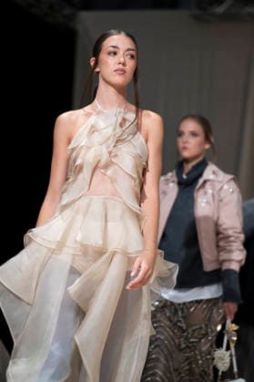 ROMANIAN DESIGNERS - MOMAD Fashion Week de Madrid ,Spain - 24 Jul 2026 A model walks the runway wearing a design by Romanian designers during Momad Fashion Week de Madrid in IFEMA Madrid Spain Copyright: xAtilanoxGarciax xSOPAxImagesx photo03135