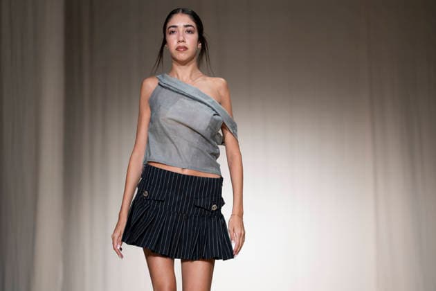 ROMANIAN DESIGNERS - MOMAD Fashion Week de Madrid ,Spain - 24 Jul 2026 A model walks the runway wearing a design by Romanian designers during Momad Fashion Week de Madrid in IFEMA Madrid Spain Copyright: xAtilanoxGarciax xSOPAxImagesx photo03156