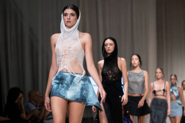 ROMANIAN DESIGNERS - MOMAD Fashion Week de Madrid ,Spain - 24 Jul 2026 A model walks the runway wearing a design by Romanian designers during Momad Fashion Week de Madrid in IFEMA Madrid Spain Copyright: xAtilanoxGarciax xSOPAxImagesx photo03167
