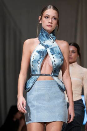 ROMANIAN DESIGNERS - MOMAD Fashion Week de Madrid ,Spain - 24 Jul 2026 A model walks the runway wearing a design by Romanian designers during Momad Fashion Week de Madrid in IFEMA Madrid Spain Copyright: xAtilanoxGarciax xSOPAxImagesx photo03168