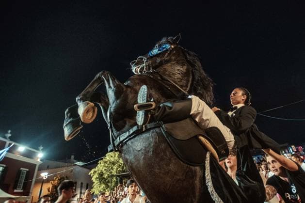 July 24, 2026, Es Castell, Menorca Balearic Islands, Spain: A caixer, or horse rider, rears his horse amid a cheering crowd during the traditional Jaleo at the Sant MartoÂ­ Festival in Es Castell. Es Castell Spain - ZUMAo105 20260724_fap_o105_003 Copyright: xMatthiasxOesterlex