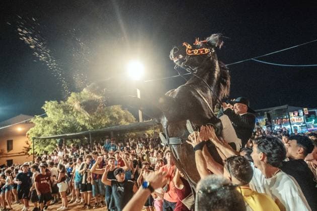July 24, 2026, Es Castell, Menorca Balearic Islands, Spain: A caixer, or horse rider, rears his horse amid a cheering crowd during the traditional Jaleo at the Sant MartoÂ­ Festival in Es Castell. Es Castell Spain  - ZUMAo105 20260724_fap_o105_004 Copyright: xMatthiasxOesterlex