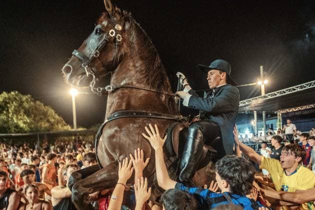 July 24, 2026, Es Castell, Menorca Balearic Islands, Spain: A caixer, or horse rider, rears his horse amid a cheering crowd during the traditional Jaleo at the Sant MartoÂ­ Festival in Es Castell. Es Castell Spain - ZUMAo105 20260724_fap_o105_005 Copyright: xMatthiasxOesterlex