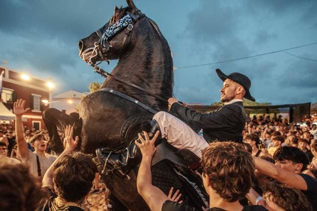 July 24, 2026, Es Castell, Menorca Balearic Islands, Spain: A caixer, or horse rider, rears his horse amid a cheering crowd during the traditional Jaleo at the Sant MartoÂ­ Festival in Es Castell. Es Castell Spain - ZUMAo105 20260724_fap_o105_006 Copyright: xMatthiasxOesterlex
