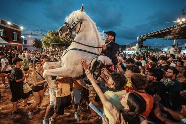 July 24, 2026, Es Castell, Menorca Balearic Islands, Spain: A caixer, or horse rider, rears his horse amid a cheering crowd during the traditional Jaleo at the Sant MartoÂ­ Festival in Es Castell. Es Castell Spain  - ZUMAo105 20260724_fap_o105_016 Copyright: xMatthiasxOesterlex